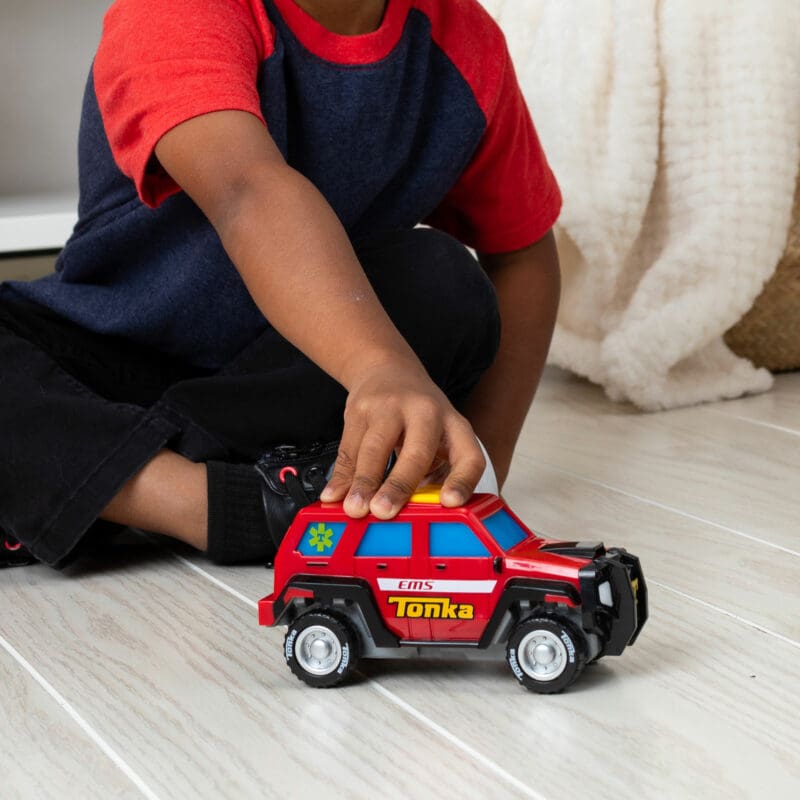 6000-Tonka-Mighty-Force-2024-First-Responder-Lifestyle2-web Tonka Mighty Force - First Responder - Lifestyle shot of boy playing with vehicle on the floor